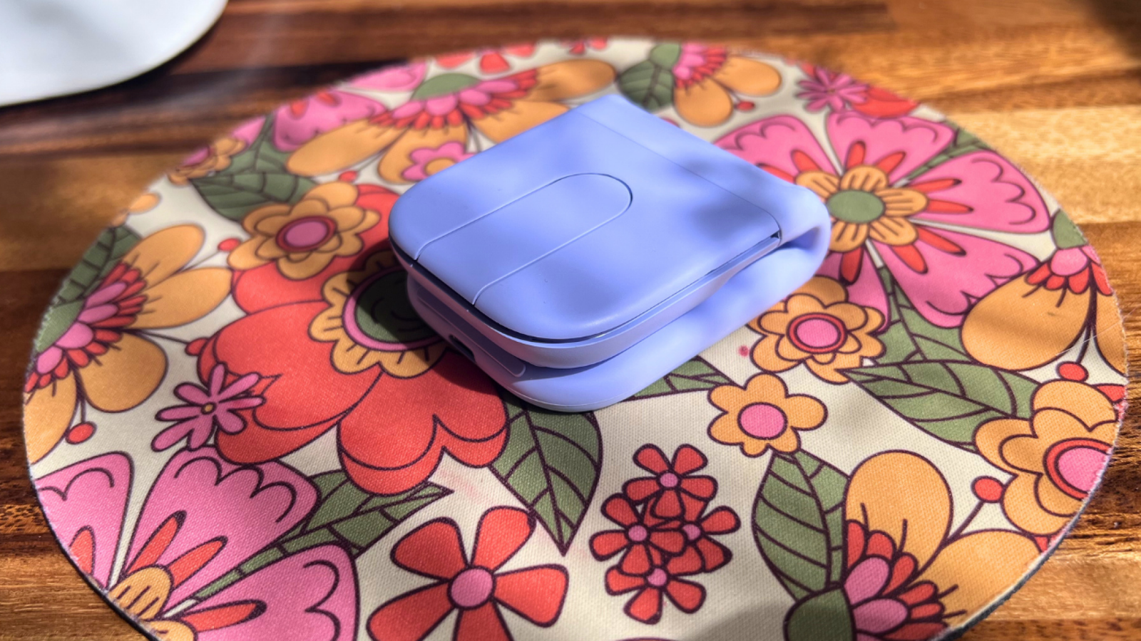 folded up Mobi Fold on floral mousepad