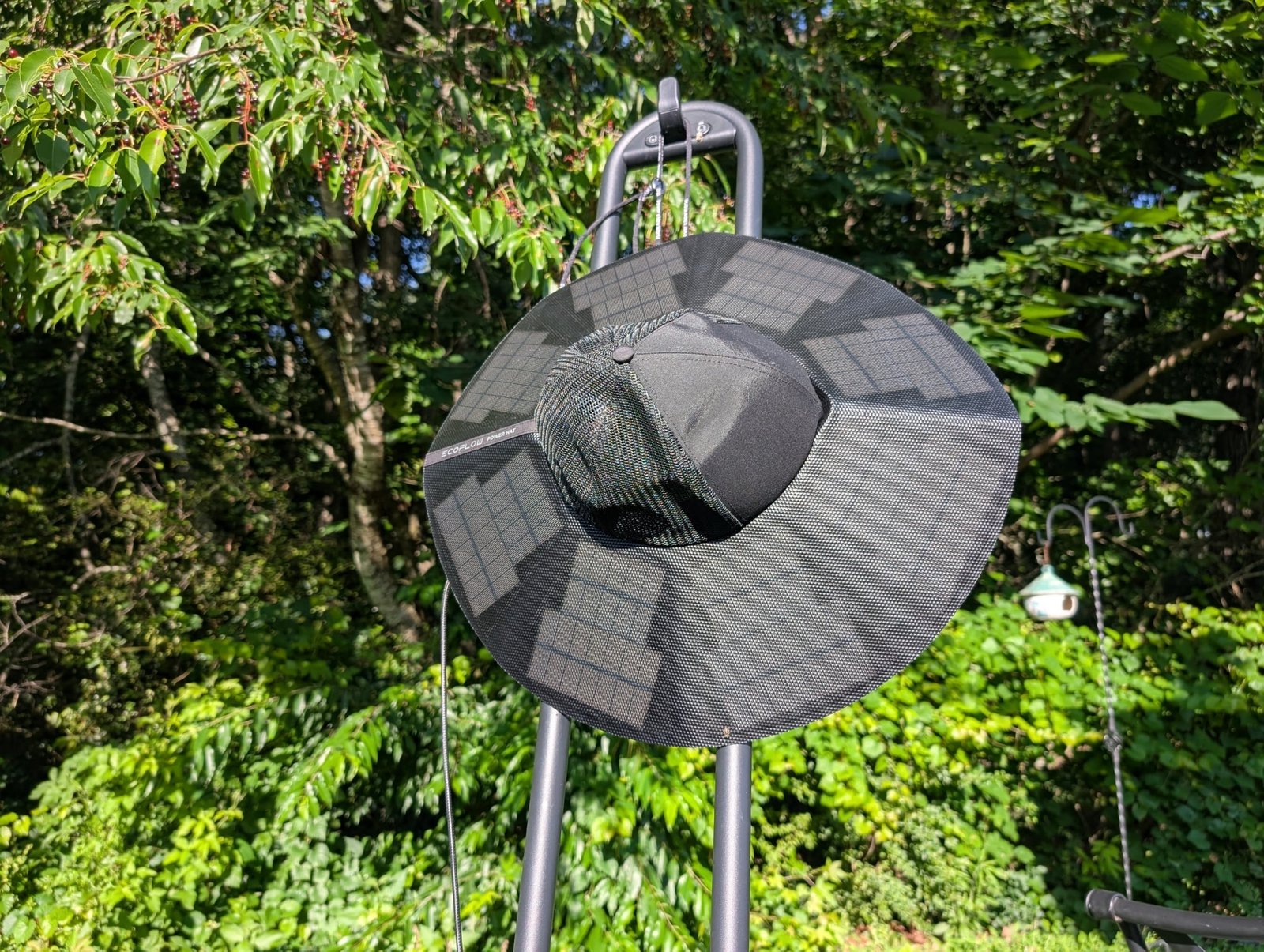 the ecoflow power hat outside with green trees behind